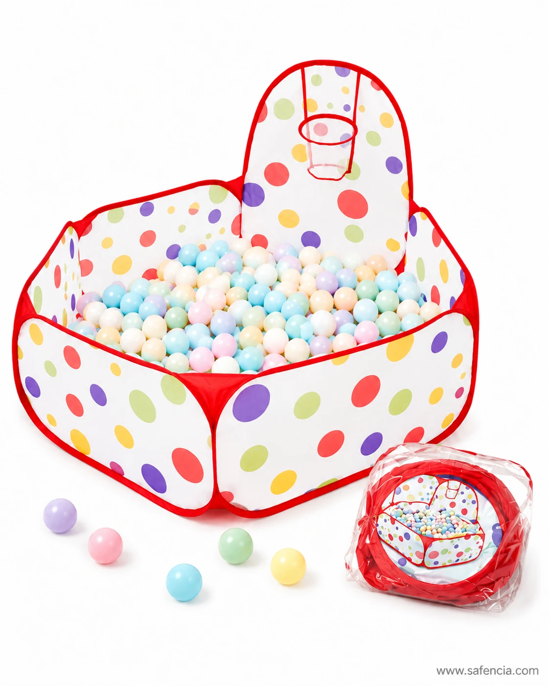 Polka dot ball pit tent seen from the side with loose play balls and its zip storage bag alongside