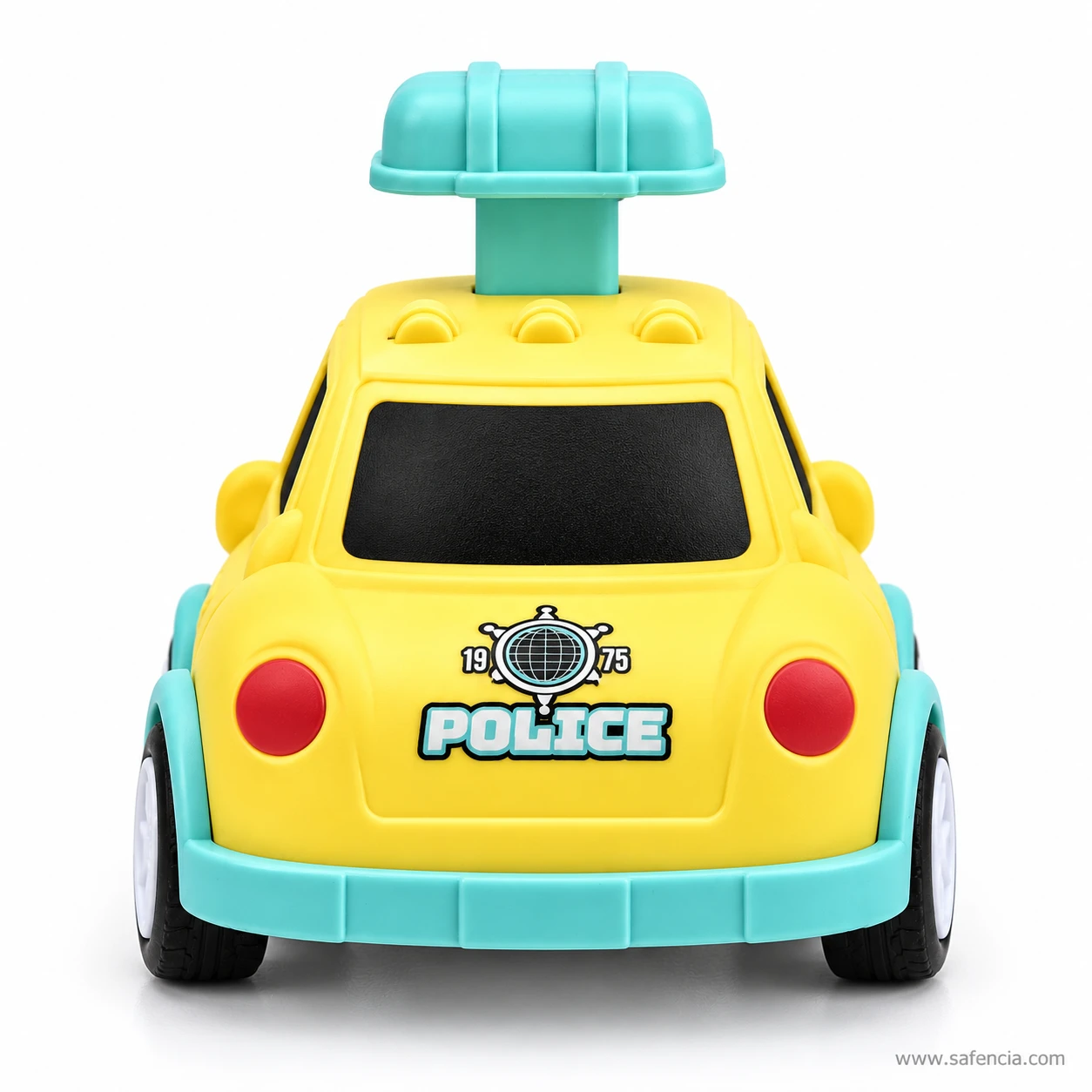 Back of the yellow police car toy with a 1975 globe badge, POLICE lettering, two red tail lights and a mint bumper