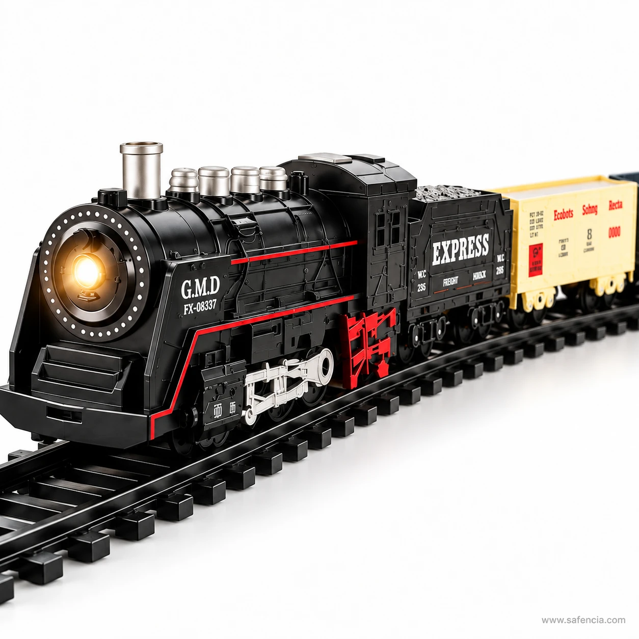 Close view of the black Rail King steam locomotive with lit headlamp, red running gear and the coal tender behind it