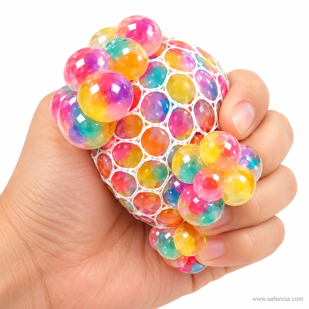 Hand squeezing the rainbow mesh stress ball so clusters of coloured bubbles pop out between the fingers
