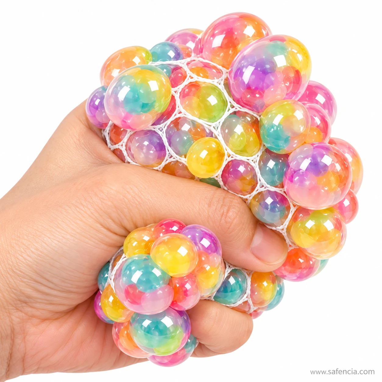 Tight grip on the rainbow mesh stress ball with bubbles bulging out above and below the hand