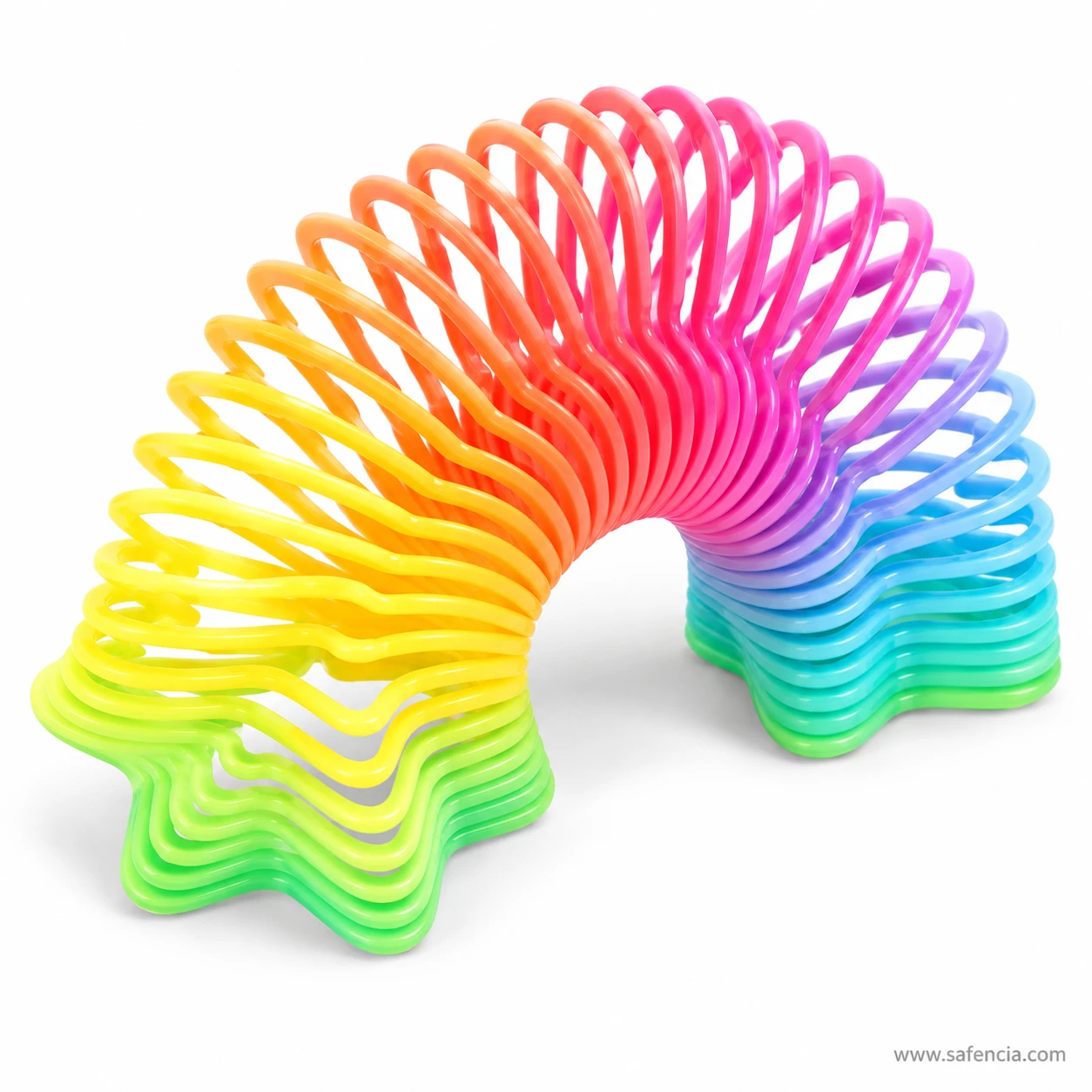 Star-shaped rainbow slinky spring toy stretched into an arch between two stacked ends