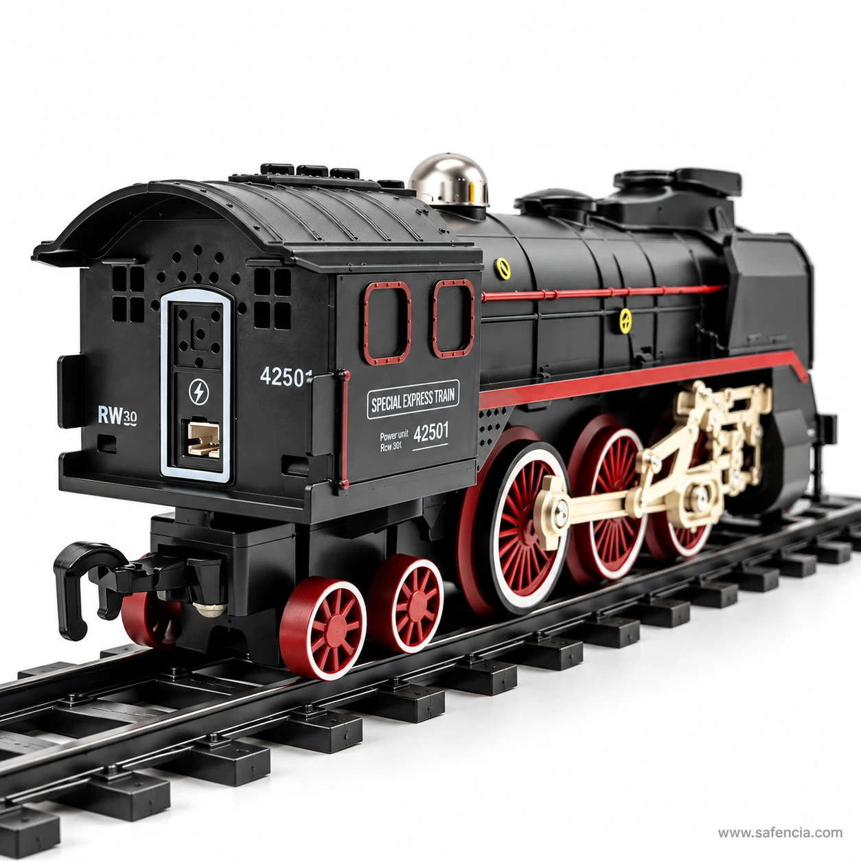 Close view of the RC steam locomotive cab and driving wheels with gold rods and red wheel centres