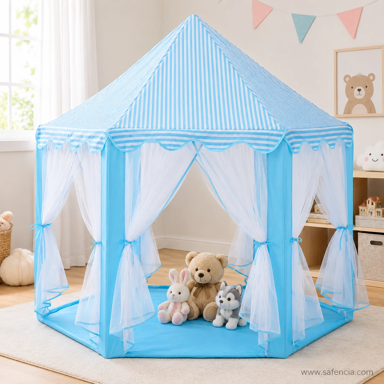Blue castle play tent set up in a child's bedroom with soft toys sitting on the tent floor