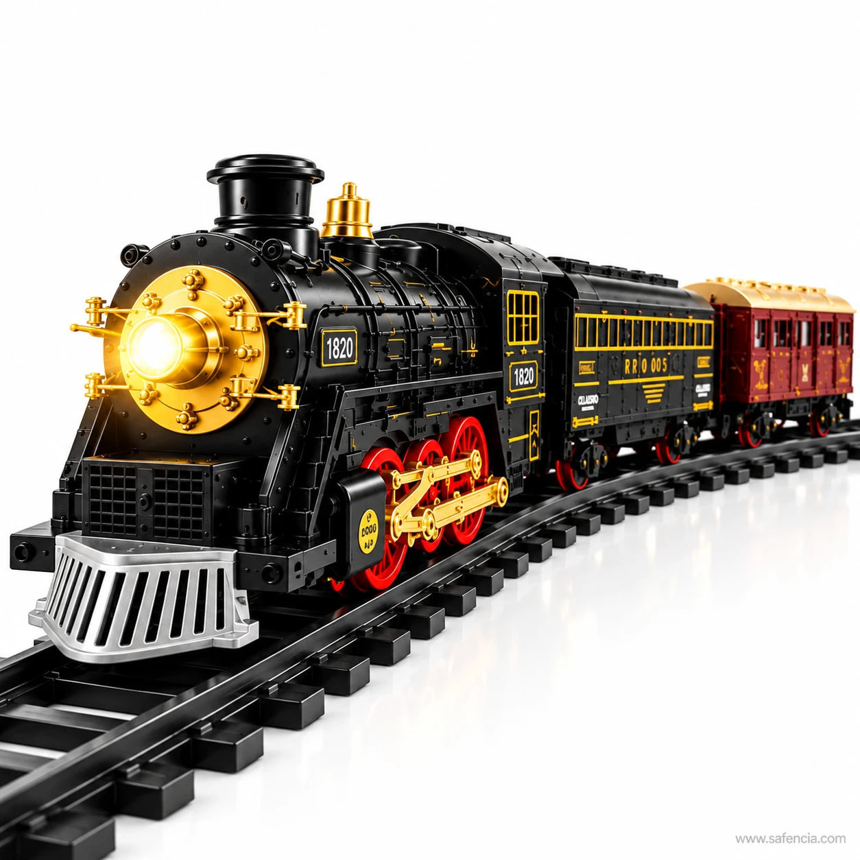 Close view of the black and gold remote control train engine with lit lamp and red rods on the driving wheels