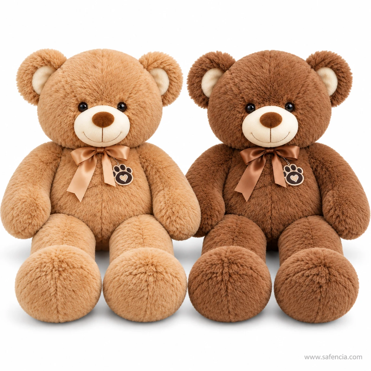 Light brown and dark brown ribbon teddy bears sitting side by side with matching satin bows