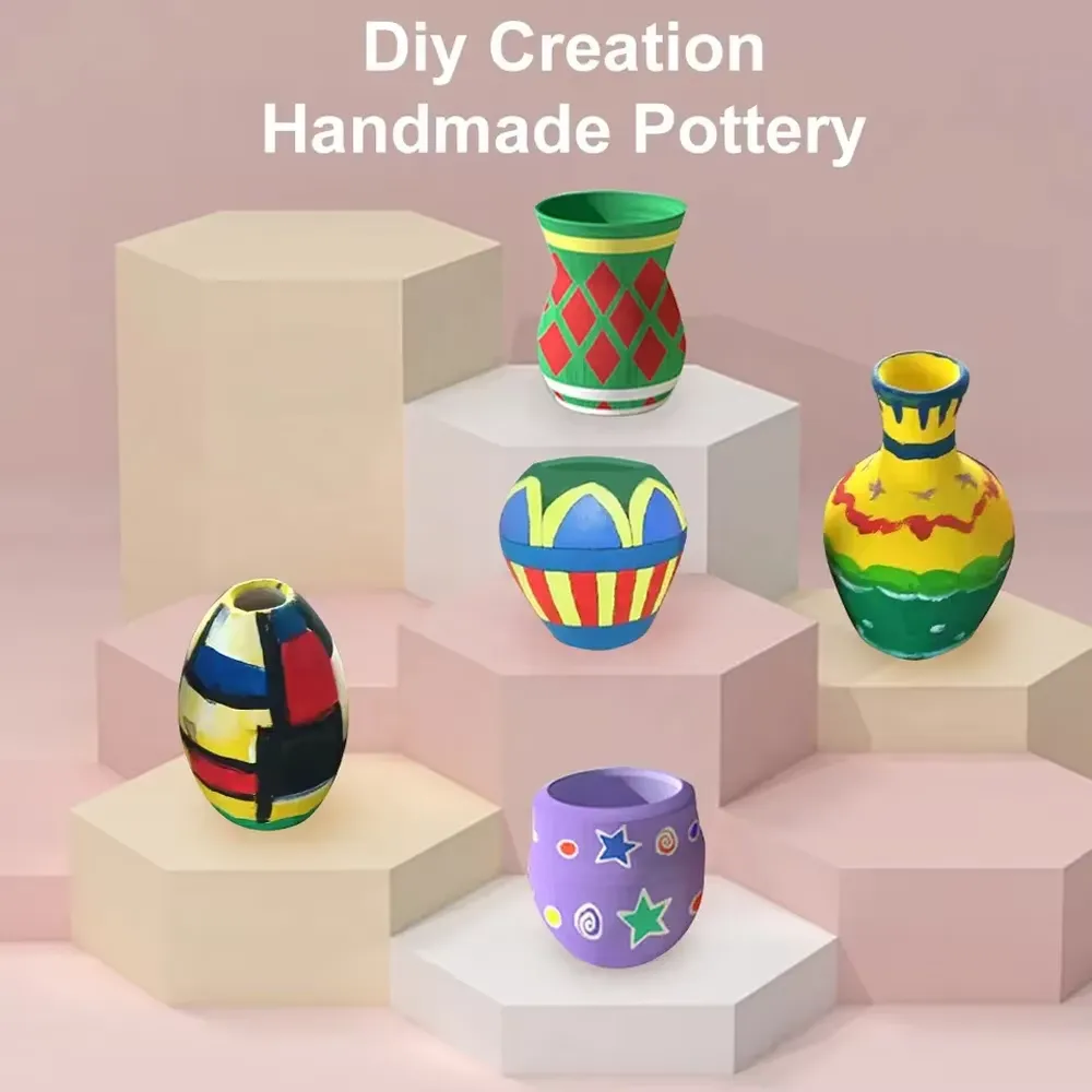 Five finished pieces of handmade pottery painted by children after shaping on the wheel