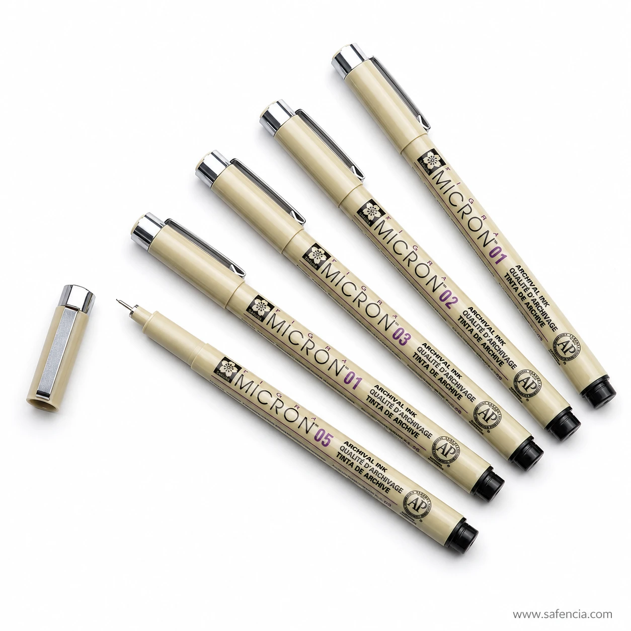 Four Pigma Micron pens grouped at an angle with one cap removed