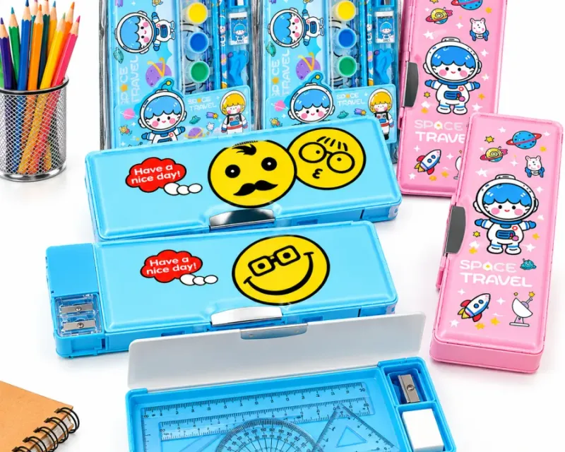 Geometry boxes collection — Dux compass and protractor instrument sets, printed metal pencil boxes and a magnetic box with a pull-out sharpener drawer