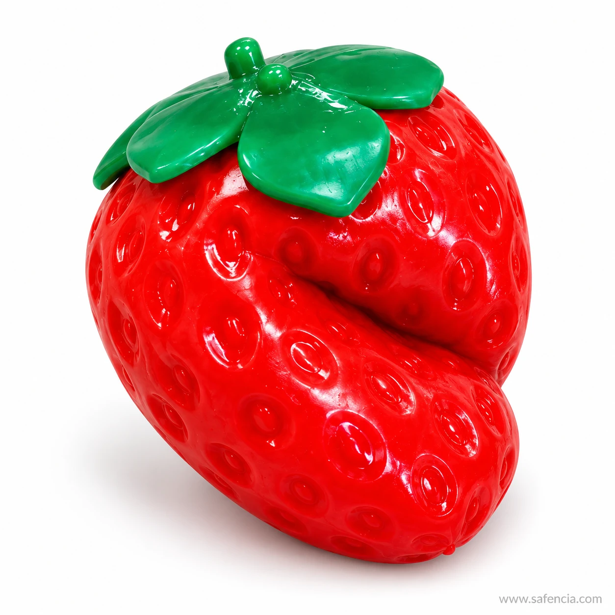 Strawberry squishy pinched in the middle so a deep crease forms across the red berry