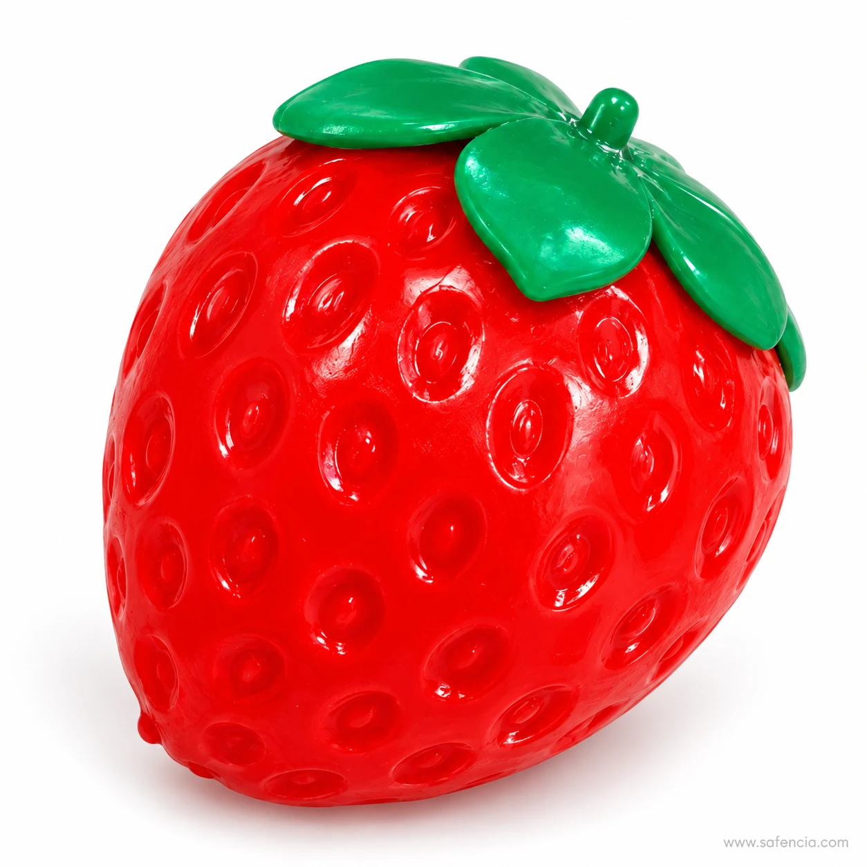 Side view of the glossy red strawberry squishy with its leaf cap and stalk