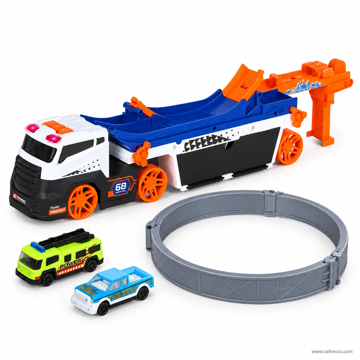 Stunt carrier truck with the loop track lifted off and standing beside it next to two die-cast cars