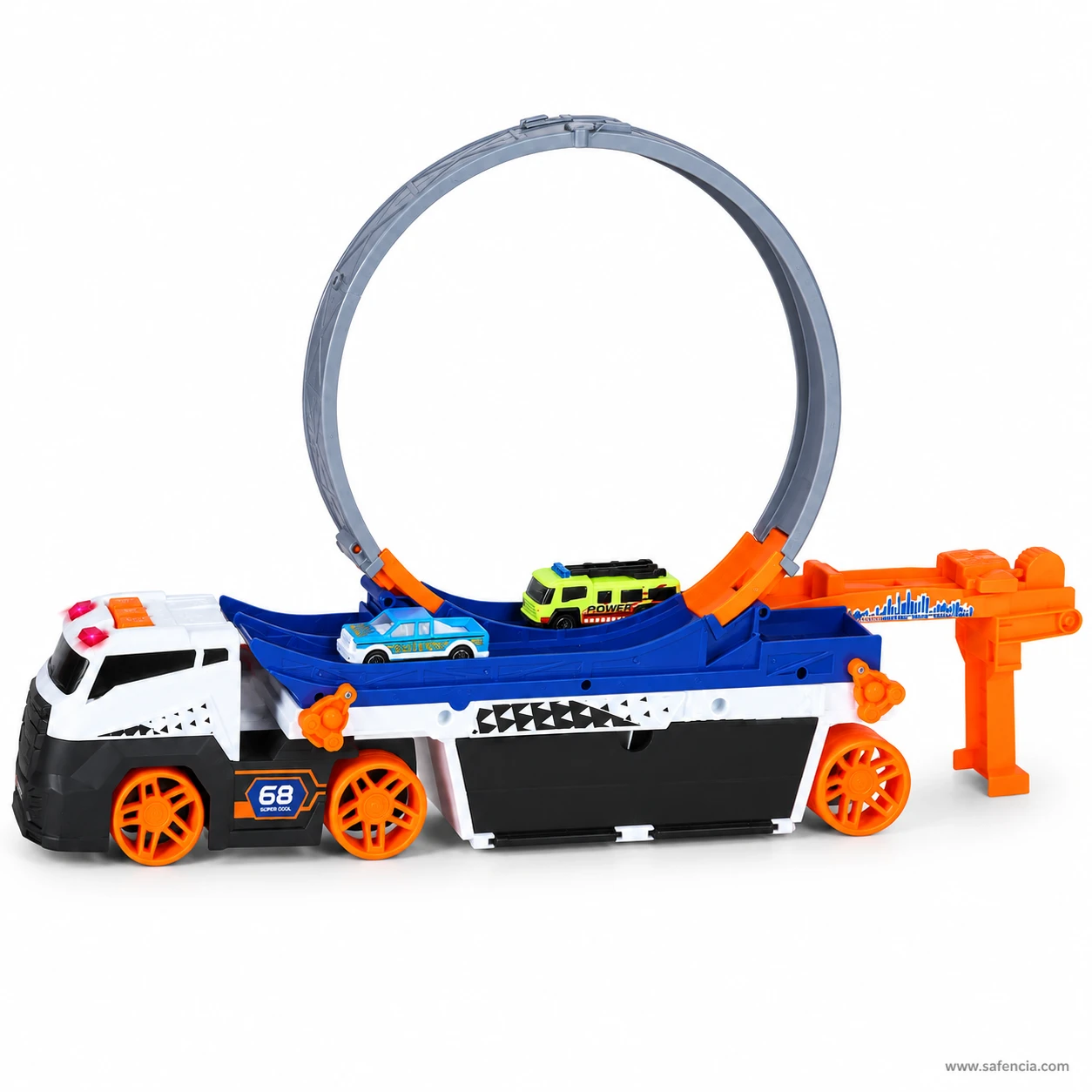 Stunt carrier truck with a green van and blue saloon die-cast car sitting on the deck in front of the loop