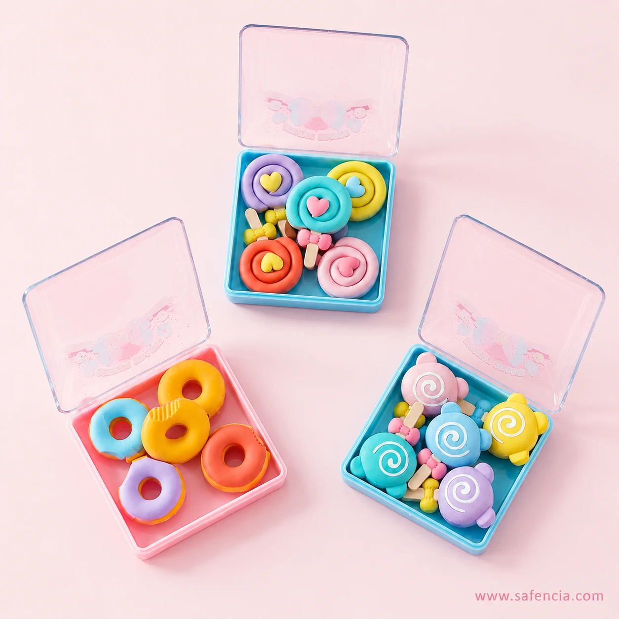 Overhead view of the three open candy eraser cases showing five pieces arranged on each coloured tray