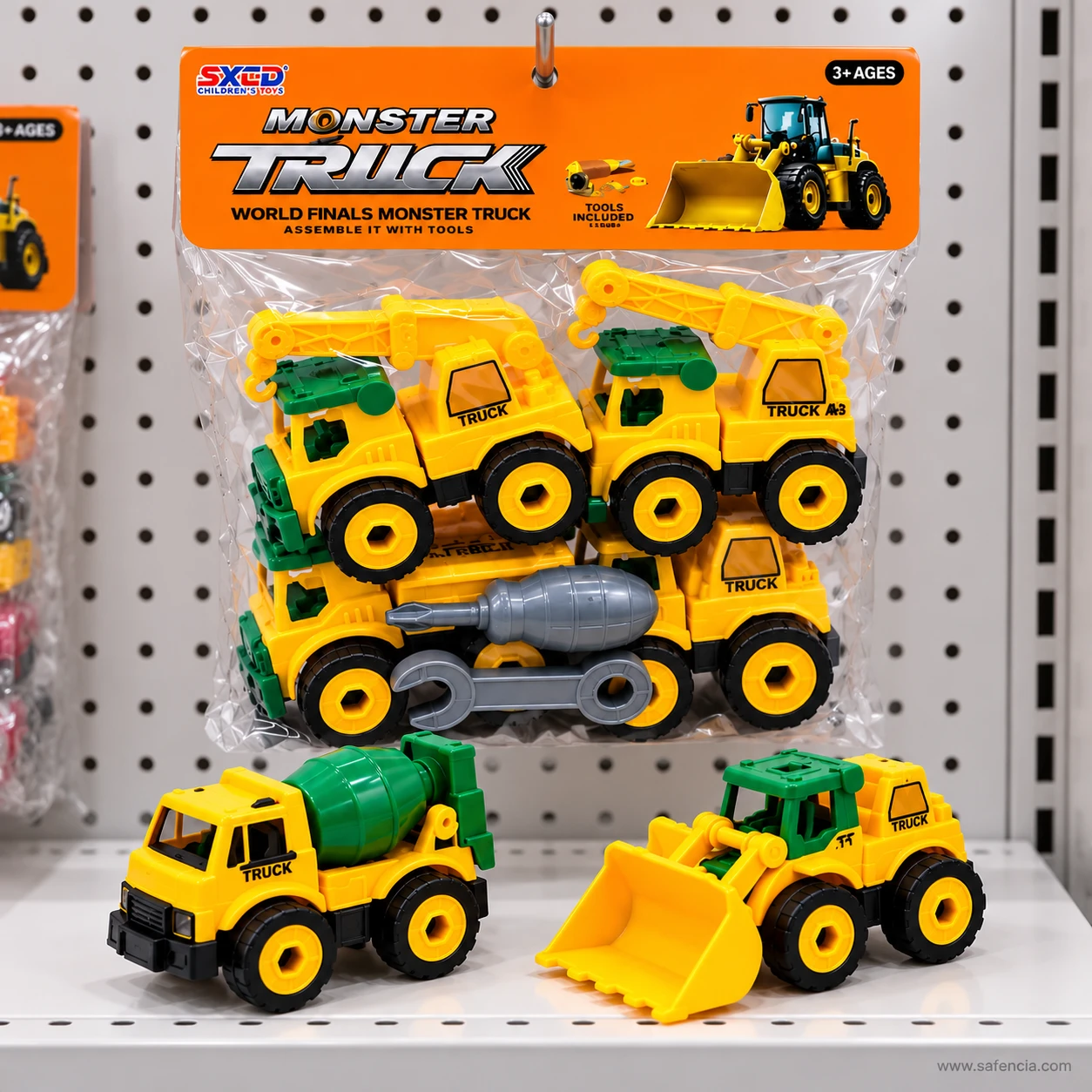 Construction truck toy pack hanging on a shop pegboard, with the cement mixer and front loader standing in front