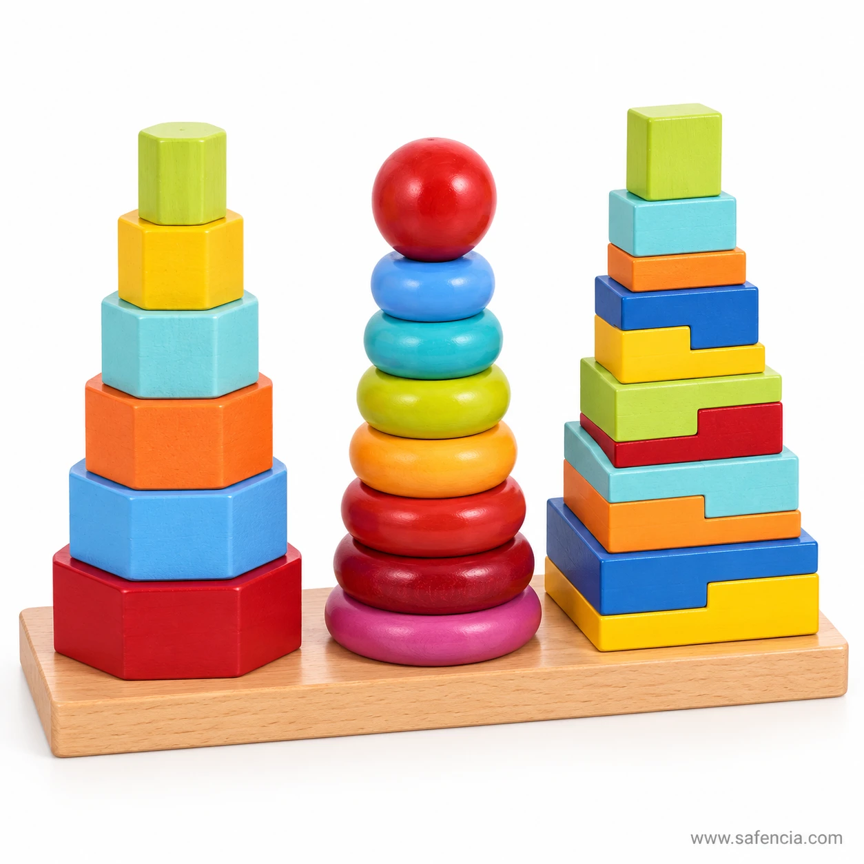 Wooden stacking tower with graded hexagon blocks from red to green beside rainbow rings and step blocks