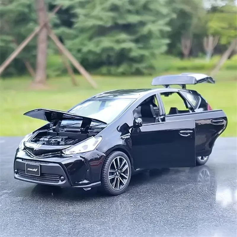 Black Toyota Prius diecast model with the bonnet open on an outdoor surface