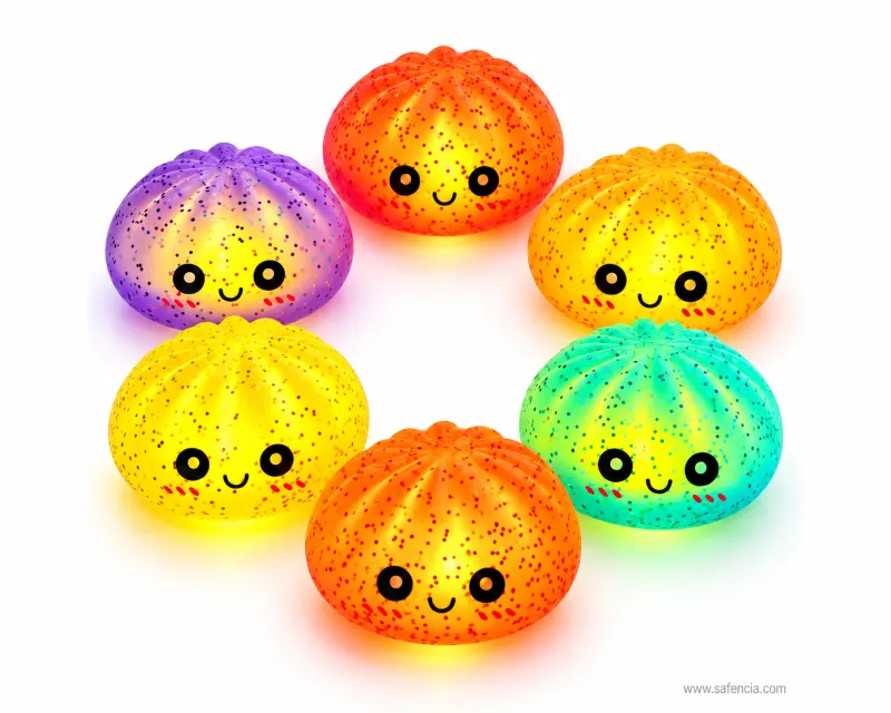 Squishy and fidget toys category — six glowing bun squishies in purple, red, orange, yellow, green and orange in Pakistan