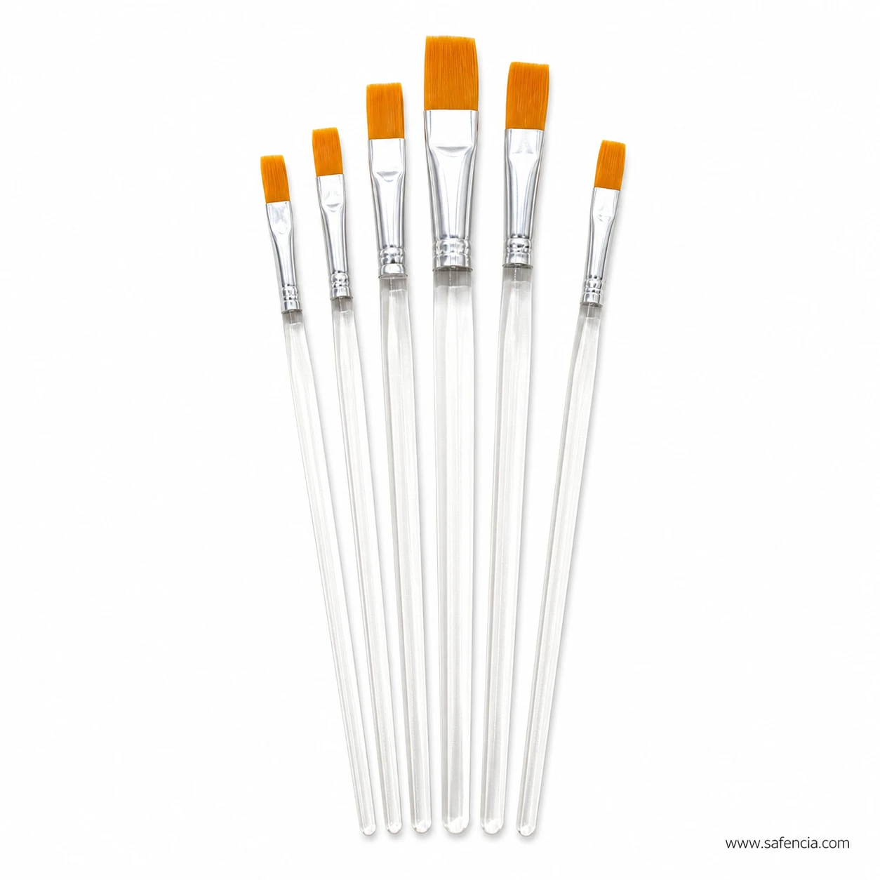 Six clear handle flat brushes laid out showing the graded head widths