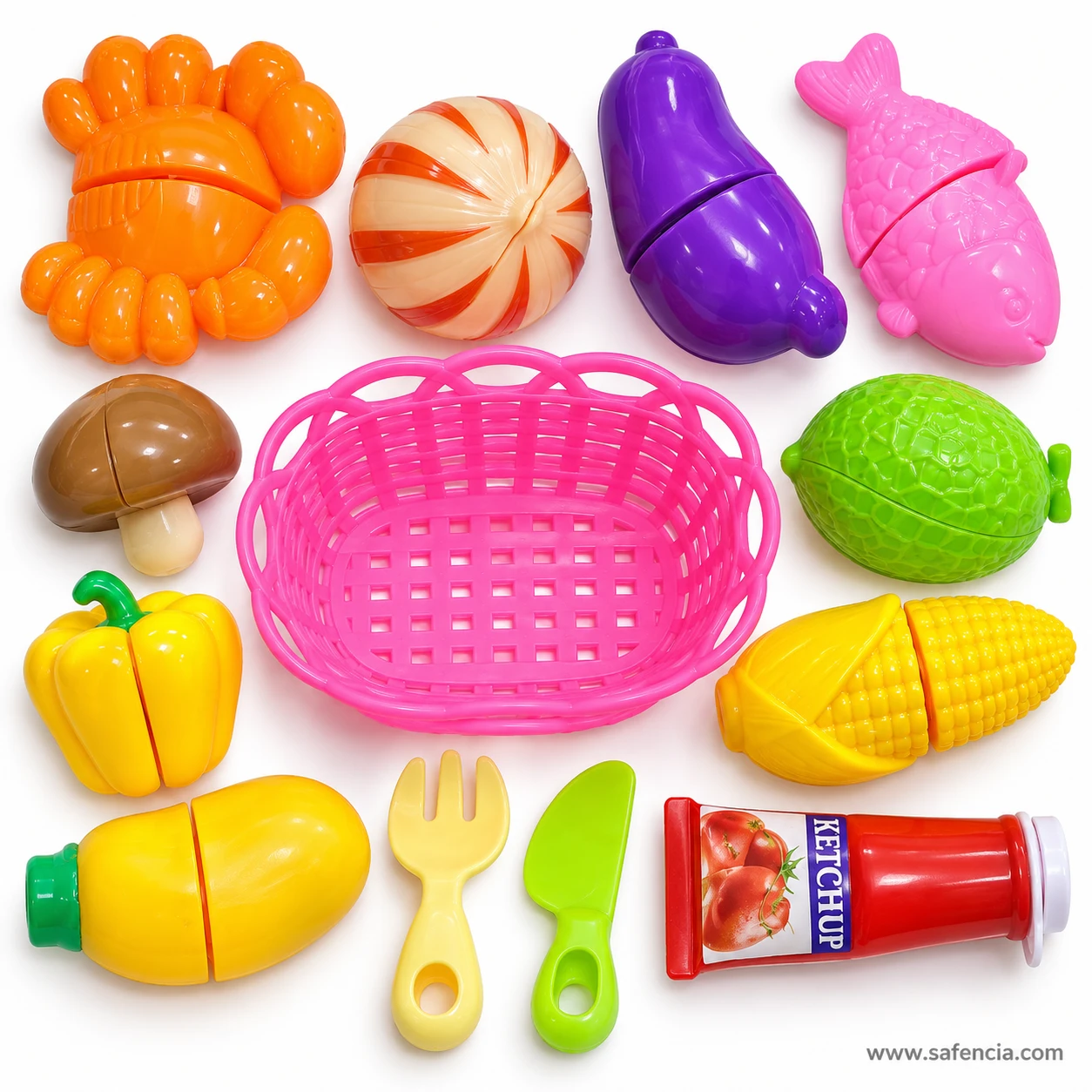 Every piece of the vegetable and fish cutting set laid out around the empty pink basket