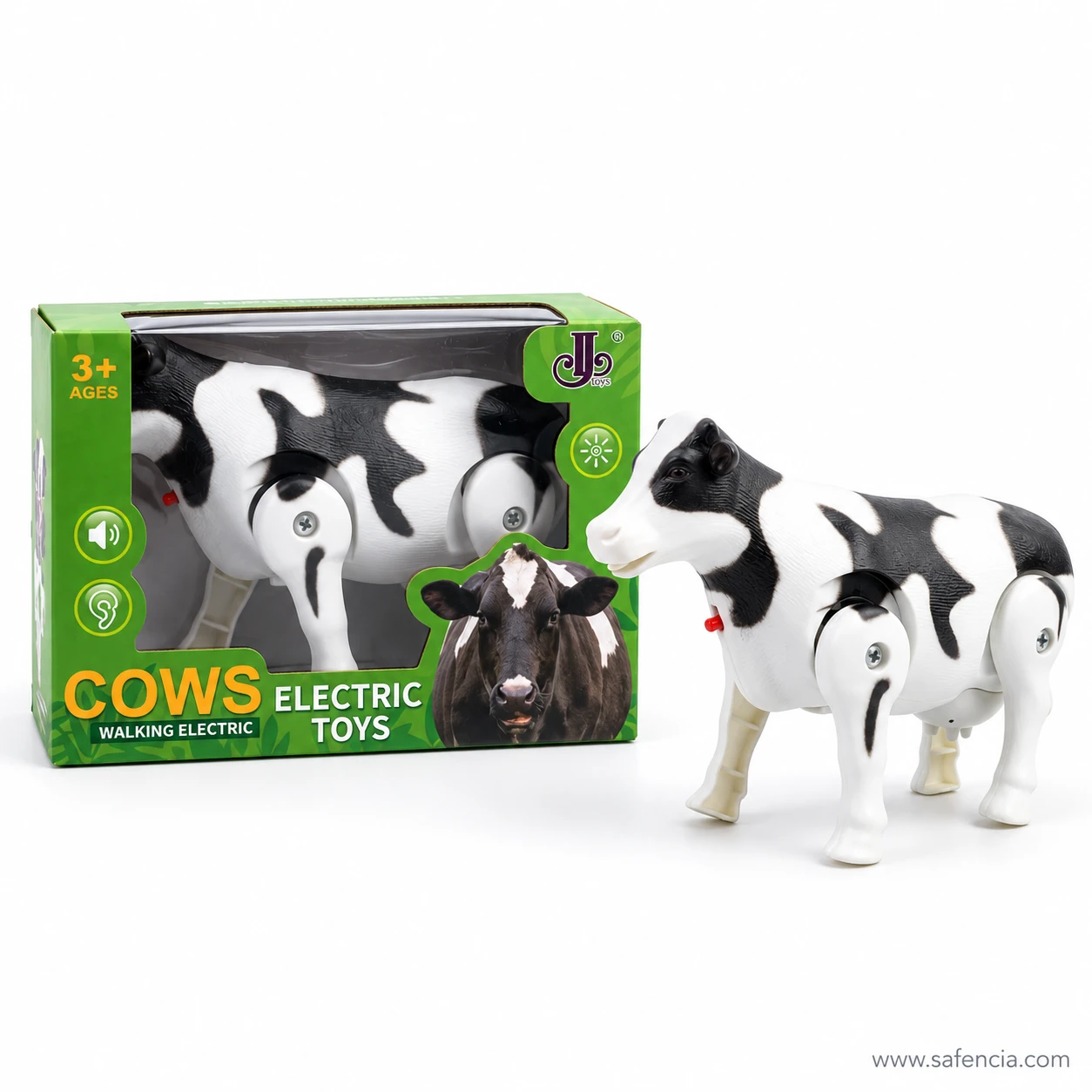 Black and white walking cow toy facing left beside its green box, with black ears and a black patch over one eye