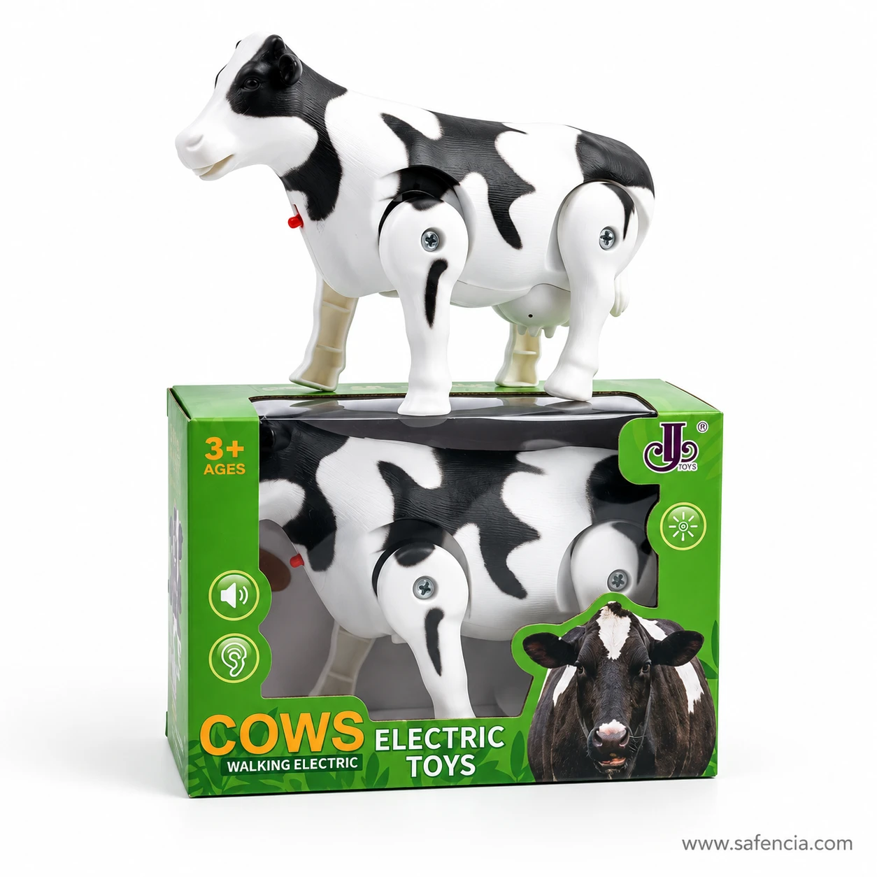 Walking cow toy standing on top of its box, showing its white body, black patches, udder and jointed legs