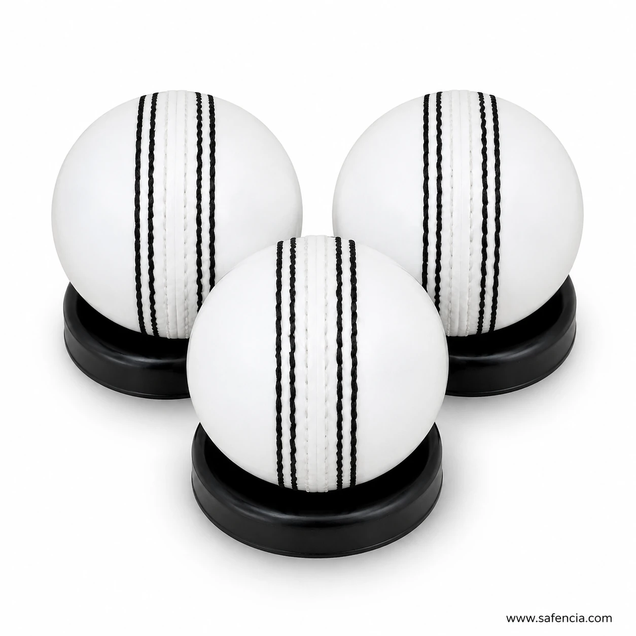 Master white practice cricket ball close up showing raised stitched black seam